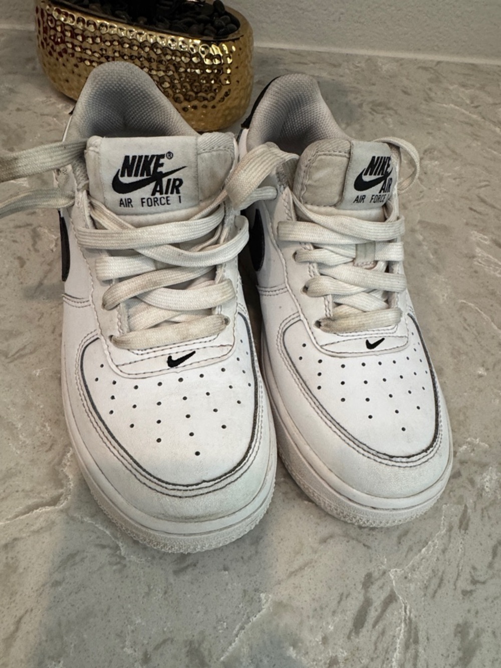 Nike Kids White Sneakers with Black Swoosh Accents